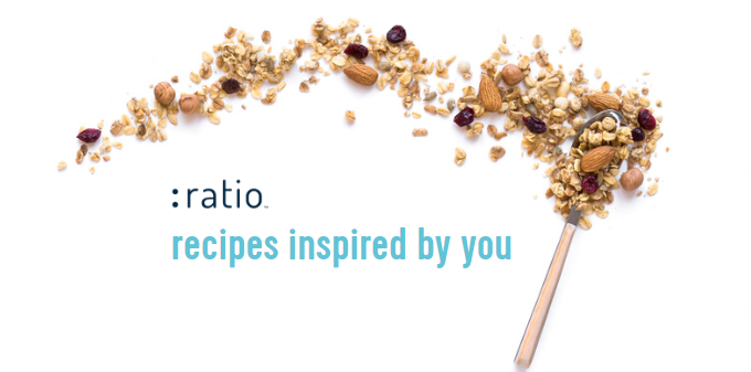 At the top, there is an uneven border of loose granola emphasizing the ":ratio" logo with the words, "recipes inspired by you" underneath it. A spoonful of granola is at the right end of the granola border.